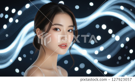 一位美麗的亞洲女性的肖像，她有著閃亮的皮膚和未來主義的燈光 127923057