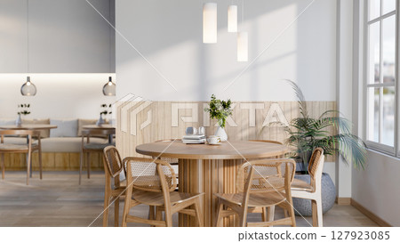 The set of wooden table and chairs next to large glass window in cafe or restaurant. Cosy Interior. The set of wooden table and chairs next to large glass window in cafe or restaurant. Cosy Interior. 127923085