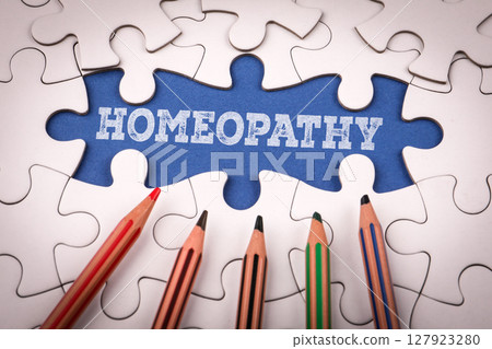 Homeopathy. White puzzle pieces and colored pencils 127923280