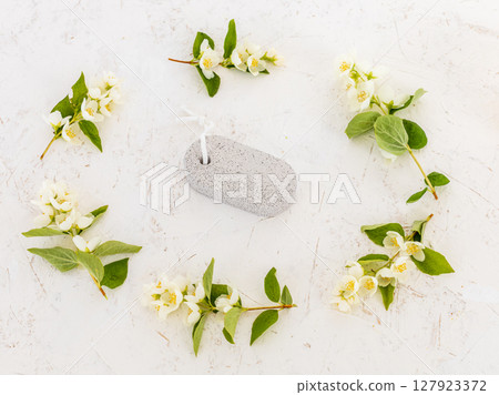 Body care products and branches of jasmine on the white background. 127923372