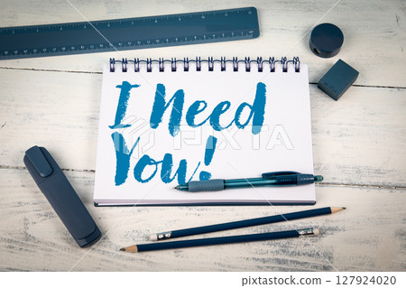 I Need You. Notebook with Office Supplies on White Wooden Background 127924020