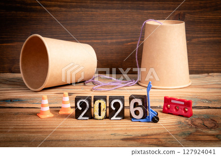 2026. Communication Strategy Planning Concept. Paper Cup Phone on Wooden Background 2026. Communication Strategy Planning Concept. Paper Cup Phone on Wooden Background 127924041