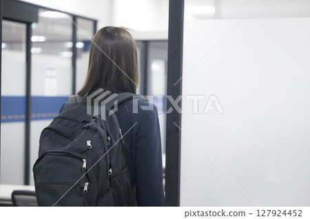 Image of a high school girl attending school or cram school, faceless, back view Image of a high school girl attending school or cram school, faceless, back view 127924452