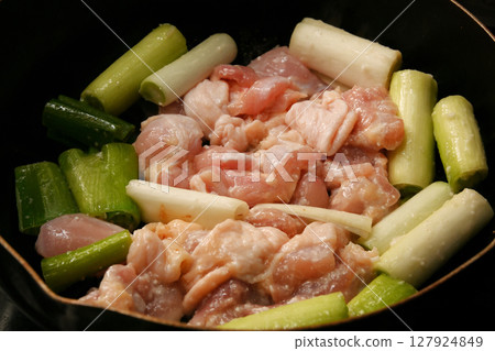 Grilled chicken thighs with green onions 127924849