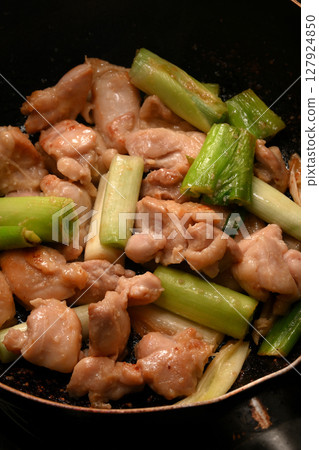 Grilled chicken thighs with green onions 127924850
