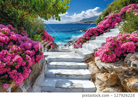 Beautiful sea view from white steps surrounded by pink flower bushes. Greek style. Summer vacation. 127926228