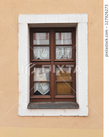 Vintage window with wooden frame and thick glass. Exterior. 127926273