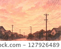 Telephone poles and cityscape at sunset 127926489
