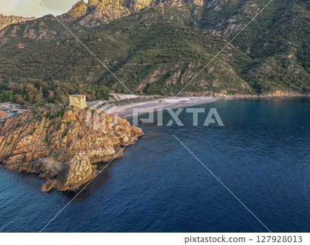Aerial view town ruins Genoese tower of Porto Corsica France medieval watchtower Mediterranean Sea Calanches de Piana Aerial view town ruins Genoese tower of Porto Corsica France medieval watchtower Mediterranean Sea Calanches de Piana 127928013
