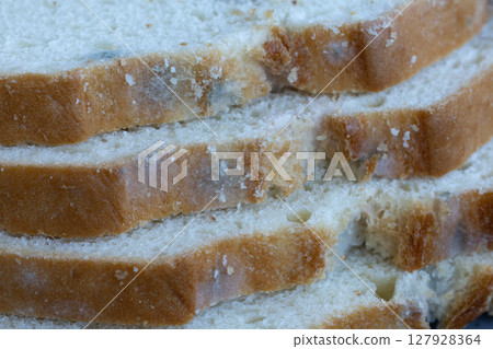 Mold on white bread close up Mold on white bread close up 127928364