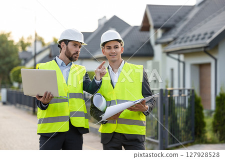 Engineers coordinating project with technology 127928528