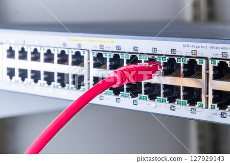 red network cable connected to witch 127929143