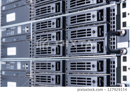 cluster of data storage SSD hard drives inside server rack 127929154