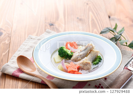 Western-style chicken wing pot-au-feu soup with colorful vegetables and warm home-cooked food Western-style chicken wing pot-au-feu soup with colorful vegetables and warm home-cooked food 127929488
