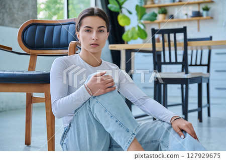 Portrait of beautiful stylish young teenage girl posing at home 127929675