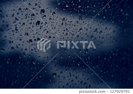Raindrops on the car window Raindrops on the car window 127929791