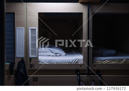 Capsule hotel offering comfortable and affordable sleeping pods Capsule hotel offering comfortable and affordable sleeping pods 127930172
