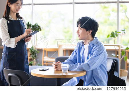 Young cafe staff/floor staff 127930935