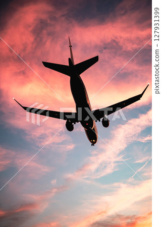 Sunset and airplane Sunset and airplane 127931399
