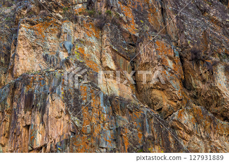 rock face in mountainous outdoor setting - full-frame background and texture 127931889