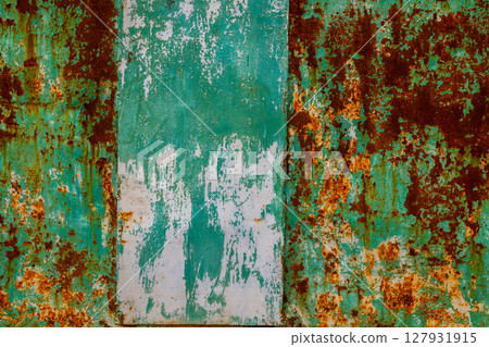 Rustic metal surface with peeling paint in industrial setting Rustic metal surface with peeling paint in industrial setting 127931915