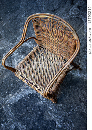 Vintage seat on a paved floor Vintage seat on a paved floor 127932104