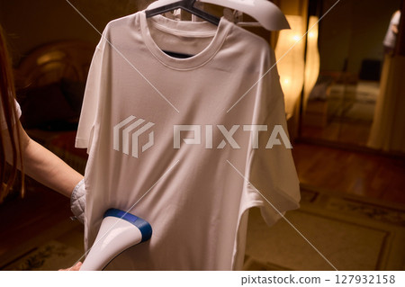 Steam your clothes at home for a fresh and stylish look that's easy to maintain 127932158