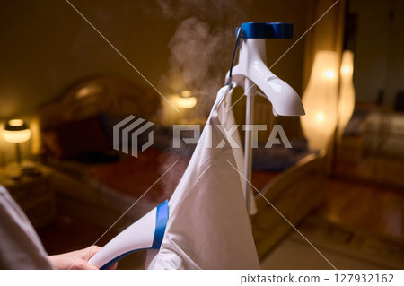 Steam your clothes at home for a fresh and stylish look that's easy to maintain 127932162