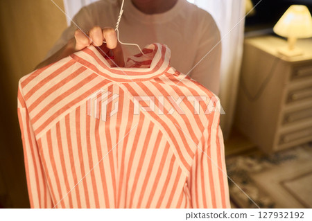 Delicate Dressing Preparing an Elegant Outfit in Soft, Cozy Lighting for Daily Wear and Style Delicate Dressing Preparing an Elegant Outfit in Soft, Cozy Lighting for Daily Wear and Style 127932192
