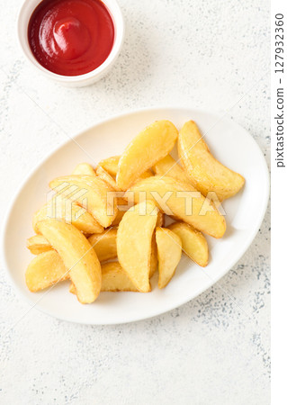 french fries on a plate 127932360
