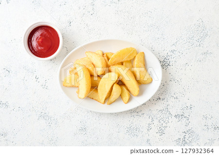 french fries on a plate 127932364