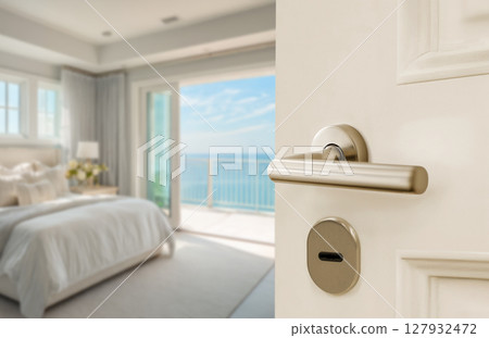 Opened White door of hotel suite sea view with blurred bedroom background Opened White door of hotel suite sea view with blurred bedroom background 127932472