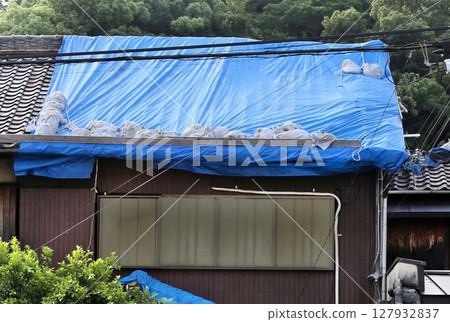 Roof tiles damaged by typhoon Roof tiles damaged by typhoon 127932837