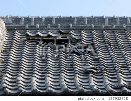 Broken roof tiles Broken roof tiles 127932858