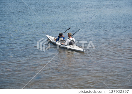 Two-seater river kayak: Parent and child river fun 127932897