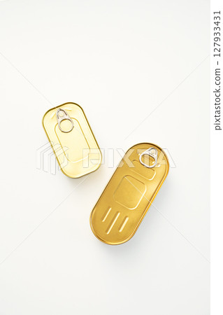 Two Golden Tin Cans with Pull Tabs on White. Canned Food and Sealed Packaging. Two Golden Tin Cans with Pull Tabs on White. Canned Food and Sealed Packaging. 127933431