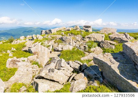 carpathian mountain range landscape in summer. beautiful alpine scenery with huge white sharp stones among the grassy meadow near hillside in morning light. stunning view in to the distant open vista 127933506