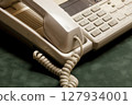 vintage phone with handset and answering machine on green velvet,the handset lies next. 127934001