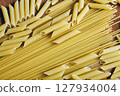 Different mix of pasta on wooden rustic background. The concept of diet 127934004