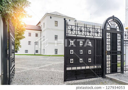 Two floors semi detached white country houses with front garden and white fence 127934053