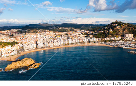 Aerial view of Blanes on Mediterranean coast with Sa Palomera Rock and San Juan hill 127935243