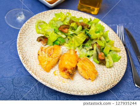 Popular dish of chicken breast with vegetable salad 127935244