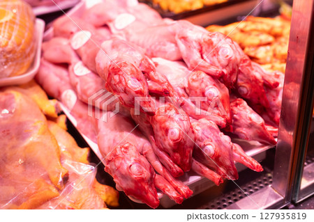 Raw rabbit carcasses on store shelf 127935819