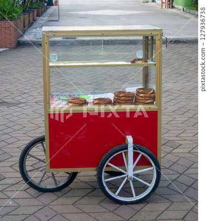 Mobile stall with Turkish pretzels. Snack on the go. Small business at the resor Mobile stall with Turkish pretzels. Snack on the go. Small business at the resor 127936738