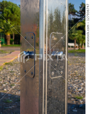 Shower on the beach. Modern shower outside. Resort by the sea. Shower on the beach. Modern shower outside. Resort by the sea. 127936747