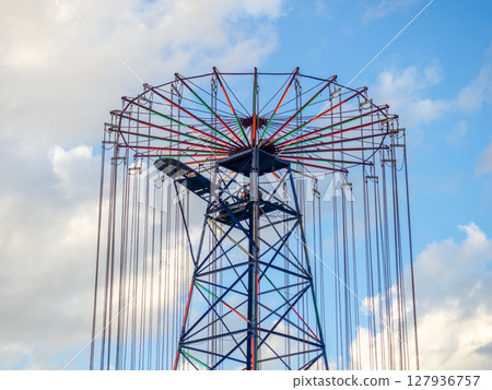 Amusement park. Entertainment concept. Carousel for children and adults. Thrilling sensations. Amusement park. Entertainment concept. Carousel for children and adults. Thrilling sensations. 127936757