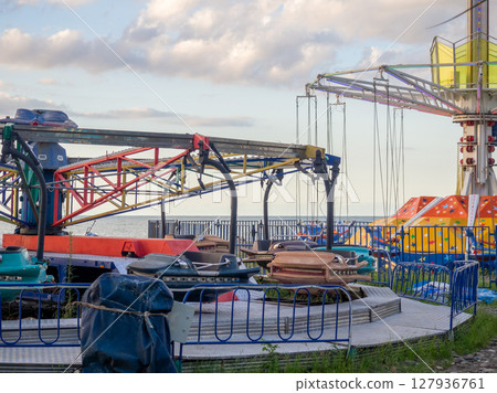 Amusement park. Entertainment concept. Carousel for children and adults. Thrilling sensations. 127936761