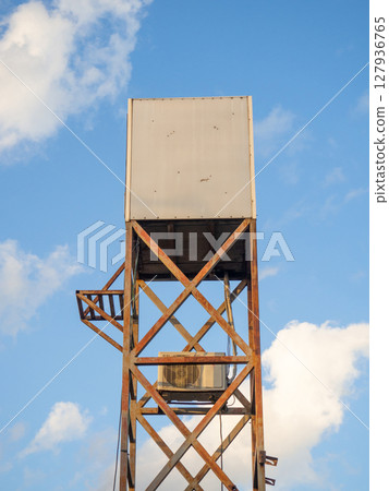 air conditioner is attached to an iron structure. Tower with air conditioning. air conditioner is attached to an iron structure. Tower with air conditioning. 127936765