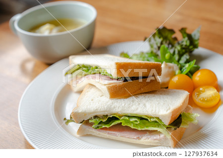 Ham sandwich and vegetable salad breakfast plate Ham sandwich and vegetable salad breakfast plate 127937634