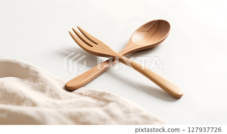 wooden spoon and fork on white background 127937726
